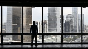 4k a businessman overlooking the urban building and skyscrapers Scene.a financial tech digital data globe,tech network,complexity and data flood of modern digital age.Business figures. cg_05303_4k - Powered by Shutterstock - Get 15% off with code: PIKWIZARD15