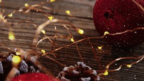 Digital composite of Video composition with snow over desk with Christmas decoration