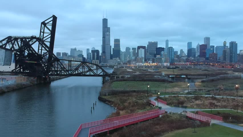 Yellow water taxi traveling up river heading to downtown Chicago