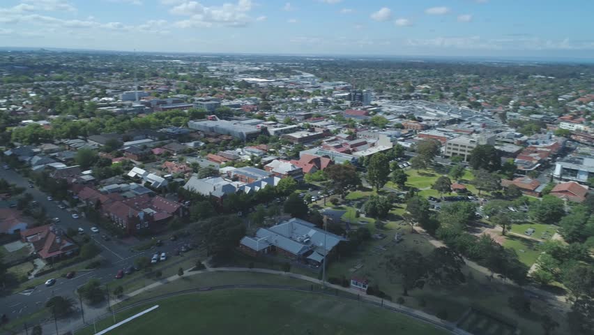 Round aerial pan across houses in Melbourne, Australia
