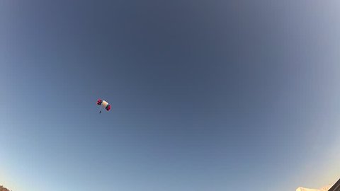 A skydiver landed and hit the target.
