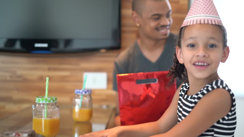 Portrait of Daughter and Father celebrating birthday party