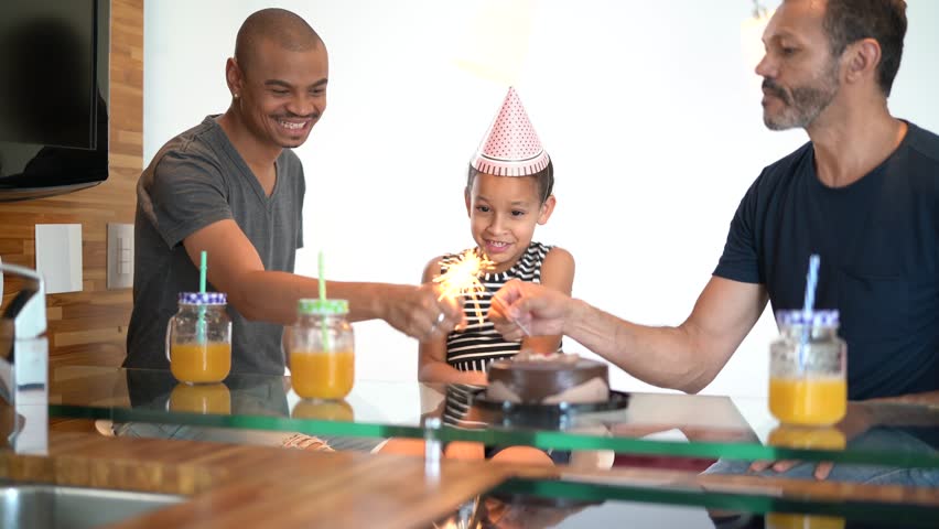 Modern Family - Gay Couple with Adopted Children - celebrating birthday party