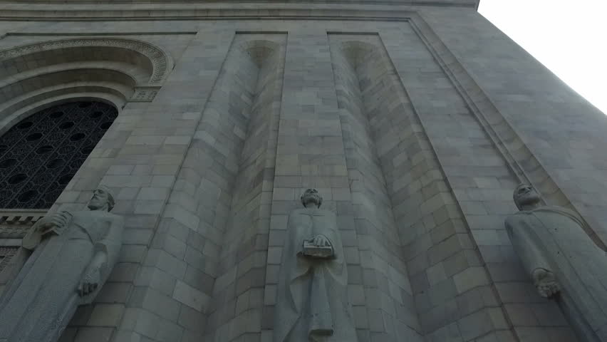 Tilt up shot over some statues which are part of the Mesrop Mashtots Institute of Ancient Manuscripts known as Matenadaran.