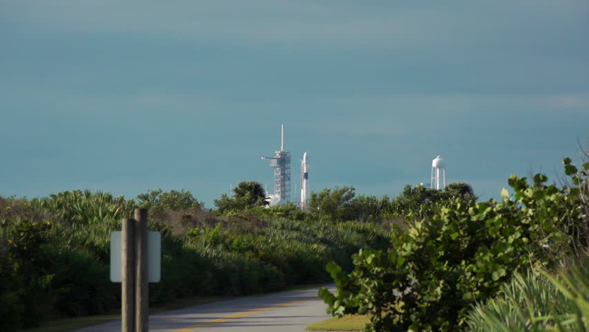 Rocket blasts off from launch pad at Kennedy Space Center. Wide angle with audio. Royalty-Free Stock Footage #1019904793