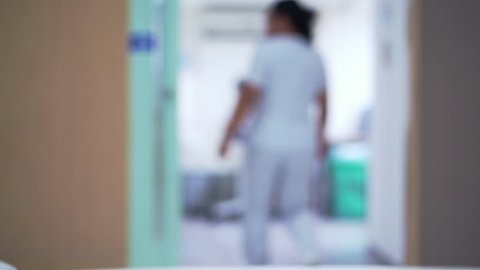 Blurred shot of nurse walking and operating in hospital,Slow motion