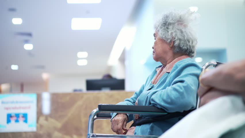 Elder patient woman on wheelchair waiting doctor in hospital | Shutterstock HD Video #1019917567
