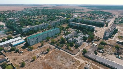  Amazing  bird`s eye shot of Askania-Nova village, the heart of Oleshky steppe bio-reserve with high houses, fields, lawns, parks and gardens in summer 