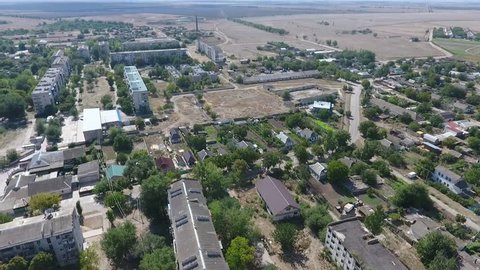  Stunning bird`s eye shot of Askania-Nova village, the core place of Oleshky steppe biosphere reserve with many buildings and parks in summer 