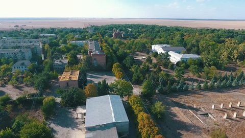  Impressive bird`s eye shot of Askania-Nova settlement, the center of Taurida steppe biosphere reserve with private houses and parks in summer 