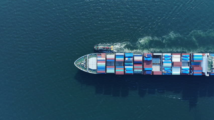 Aerial top view of cargo container ship and trug ship working dragging vessel to yard port concept freight shipping ship. | Shutterstock HD Video #1019931880