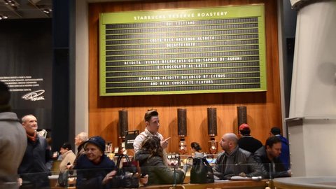 Milan, Italy - Nov 22, 2018: Baristas prepare coffee and food to serve customers at the first Starbucks concept store in Milan, Italy known as the Milano Roastery