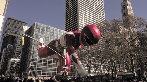 NEW YORK, USA - NOV 22, 2018 Macy's Thanksgiving day Parade, Morphin time! Red Mighty Morphin Power Ranger flying pass Bryant Park on 6th Avenue