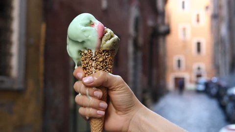 Ice Cream Melting In Hand Outdoors. Food And Travel Concept.