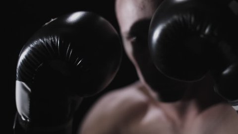 Determined Boxer Stances in Boxing Ring