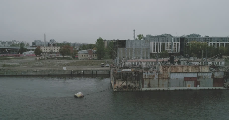 Aerial view on river and boats in Saint-Petersburg. Cloudy autumn day on Neva river.