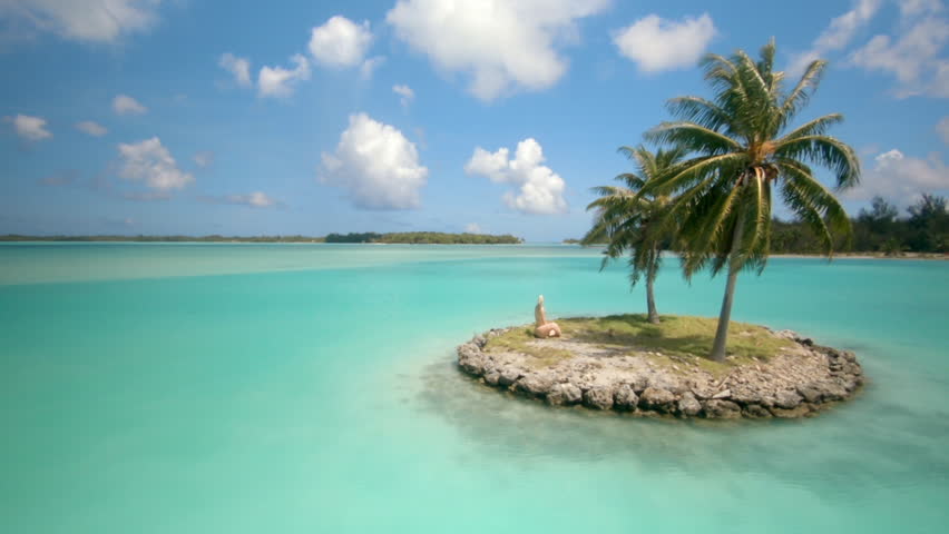 small islands in front of Bora Bora Airport. Mini Island with a single palmtree