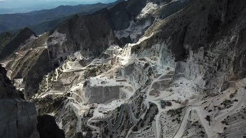 Aerial: Flying above world famous marble quarry near the city of Carrara, Tuscany, Italy