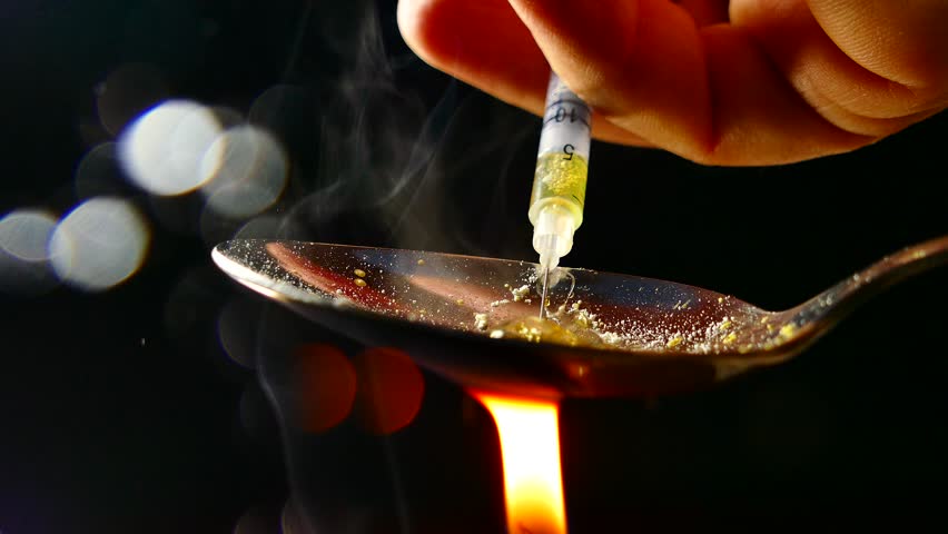 Cooking dope. Heat a spoon with heroin. Add liquid to the syringe. Medicine and poison. Hangout for drug addicts. | Shutterstock HD Video #1019960497