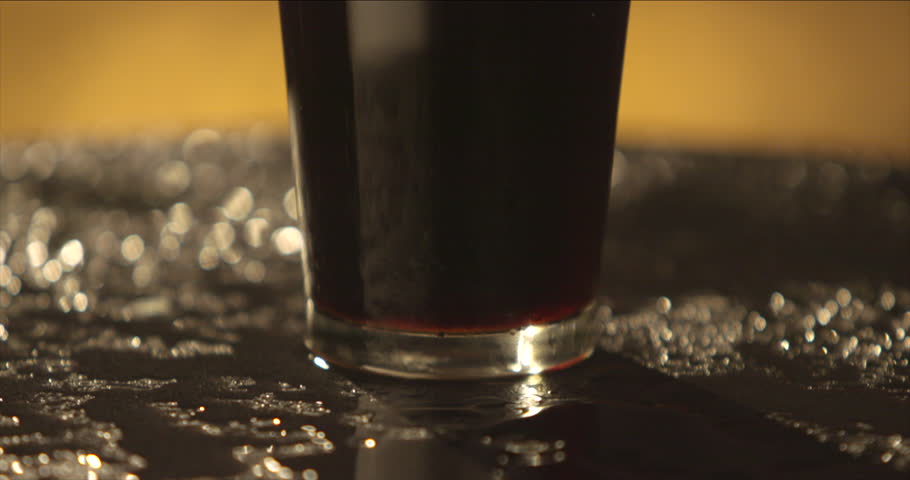 Dark beer in a glass. | Shutterstock HD Video #10199726