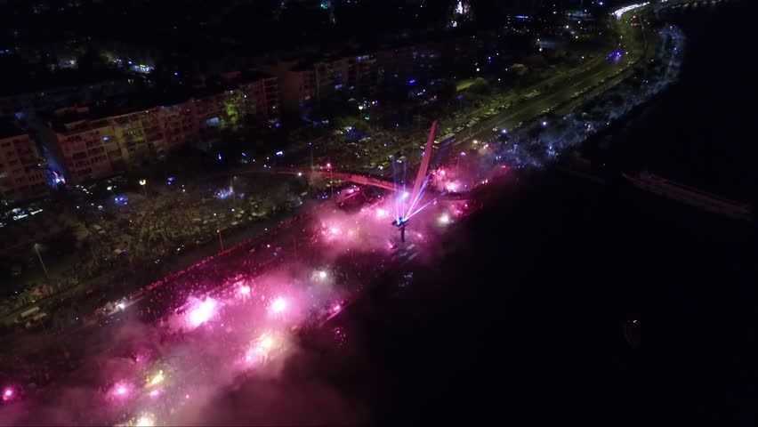 celebration by burning torch by the sea