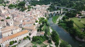 Aerial view of historic centre of Besalu with Romanesque bridge over Fluvia river, Catalonia, Spain