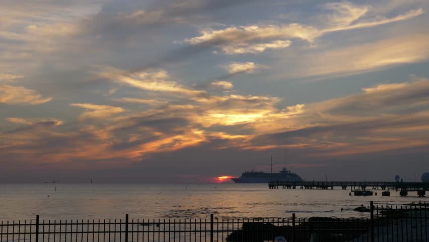 Sunset at Higgs beach Key West with Cruise ship leaving the port