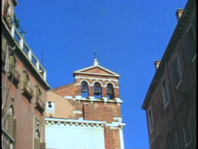 VENICE, ITALY, 1974, Bells ringing from bell tower, three bells in motion