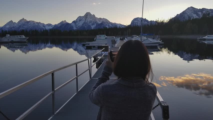 This is a footage of a girl walking in a beautiful scenery