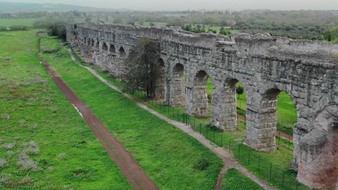 Ancient Roman aqueduct, Rome in the autumn -  aerial drone 
The Romans constructed numerous aqueducts to bring water into Rome: aqueducts moved water through gravity along a downward gradient