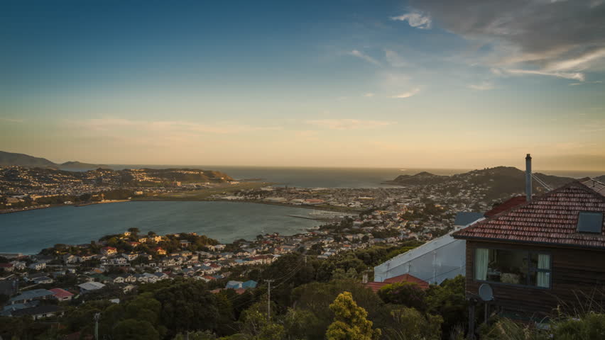 Beautiful evening in Wellington, New Zealand. Timelapse video. View towards the airport and the sea.
