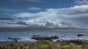 Scenic coastline of New Zealand in timelapse video on cloudy day. Shot near Wellington.