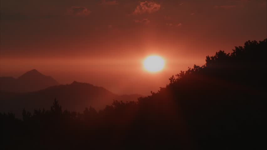 Sunrise with red Sun in the Pillerseetal