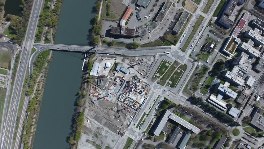 River, road and industrial zone overhead drone view. Aerial Grenoble sunny day