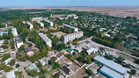 Splendid bird`s eye shot of Askania-Nova village, the center of Taurida steppe bio-reserve with various facilities, streets, and gardens in summer 