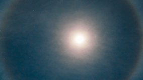 Astrophotography timelapse with zoom out motion of lunar halo - a circular rainbow forming around the moon - Powered by Shutterstock - Get 15% off with code: PIKWIZARD15