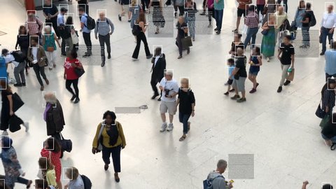High view of commuters walking. Facial recognition interface showing personal data for each person. Surveillance concept. Artificial intelligence. Deep learning.