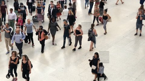 High view of commuters walking. Facial recognition interface showing personal data for each person. Surveillance concept. Artificial intelligence. Deep learning.