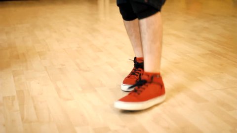 Feet of hip hop dancer on dance floor