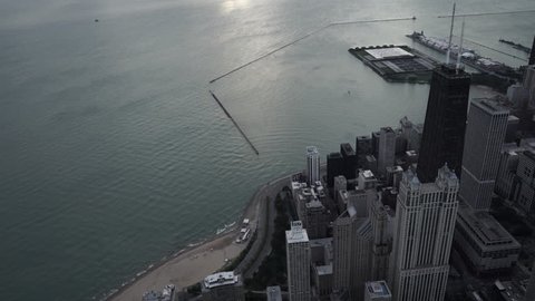 Chicago Circa-2015: Aerial view orbiting John Hancock Center and tilting up toward Navy Pier and Lake Michigan