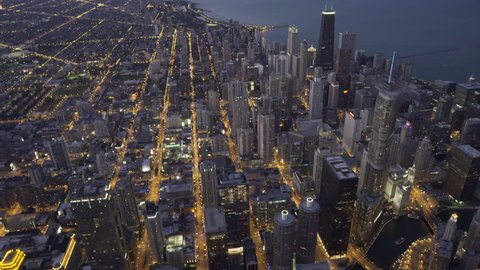 Chicago Circa-2015: Wide aerial view over River North, approaching downtown with focus on skyscrapers in the Chicago Loop at dusk