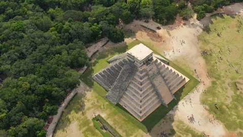 Chichen Itza, Mexico: Aerial view of ancient Mayan city, mesoamerican pyramid El Castillo (Temple of Kukulkan) surrounded by lush jungle - landscape panorama of Yucatan Peninsula from above, America