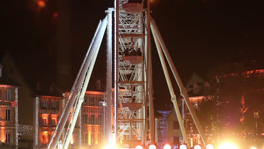 Large wheel by night at christmas market. Alsace, France