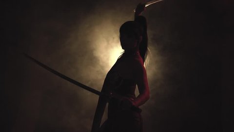 girl dancing dark red room with light smoke. cuts air with two sword, moves circle, dark black  silhouette woman ghost shadow, training queen princess fantasy art young warrior. Fashion model posing