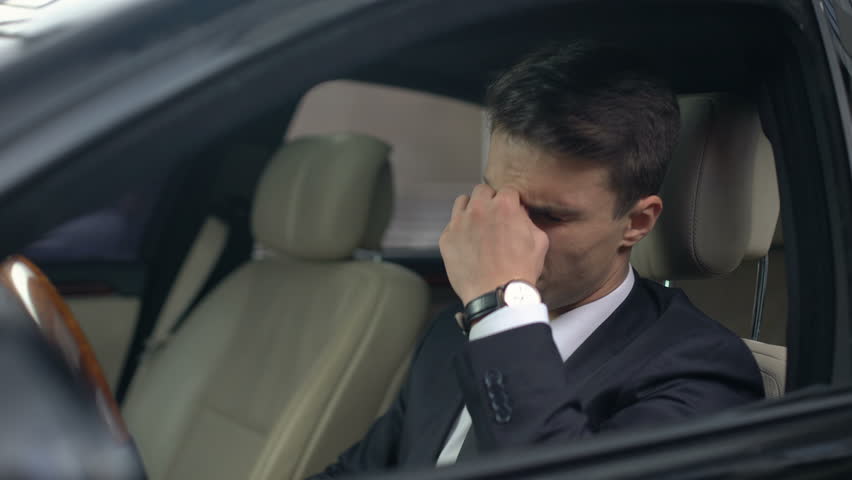 Business man with eyesight problems taking off glasses in car, stressful job | Shutterstock HD Video #1020050326