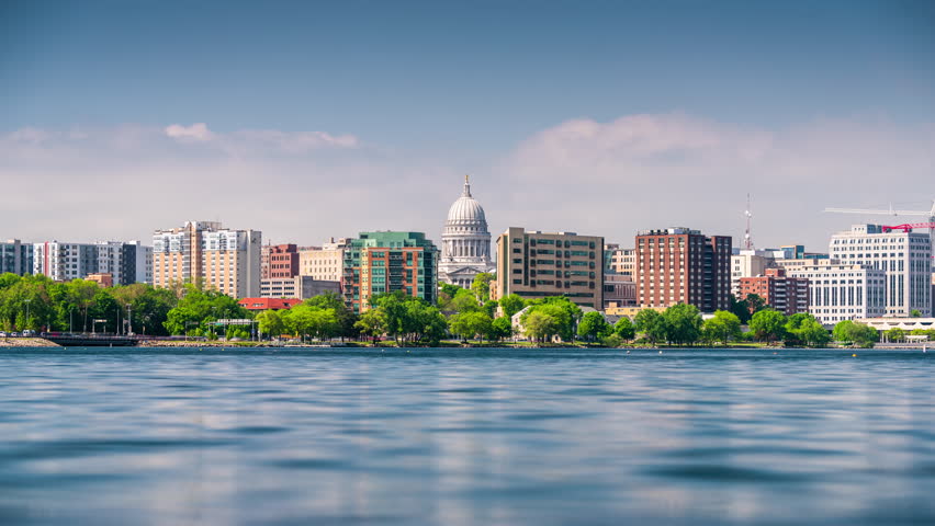 Madison, Wisconsin, USA downtown skyline at dusk on Lake Monona.