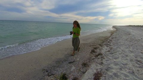 girl walking walking along the seashore