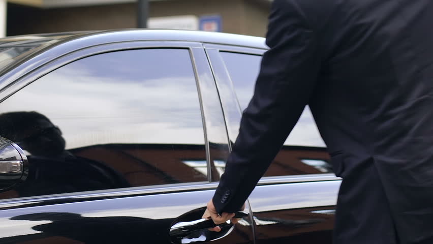 Handsome man in suit sitting on drivers seat of black fashionable car, rich man Royalty-Free Stock Footage #1020072826