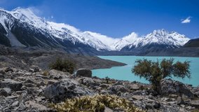 Beautiful glacial Tasman Lake in New Zealand in the heart of Southern Alps surrounded by the highest peaks covered in snow. Timelapse video.