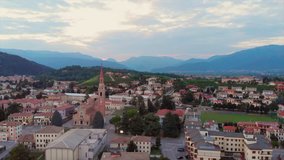 The drone flies over the Italian city / village. View of the chapel tower.
